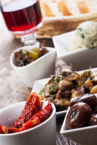 different italian antipasti and red wine